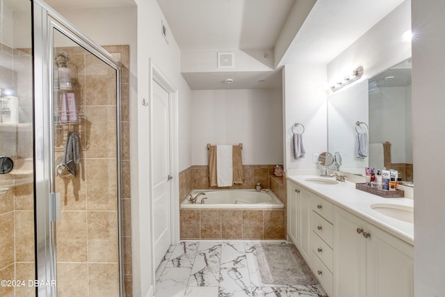 bathroom with vanity and separate shower and tub