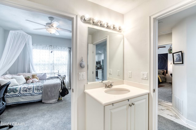 bathroom with ceiling fan and vanity