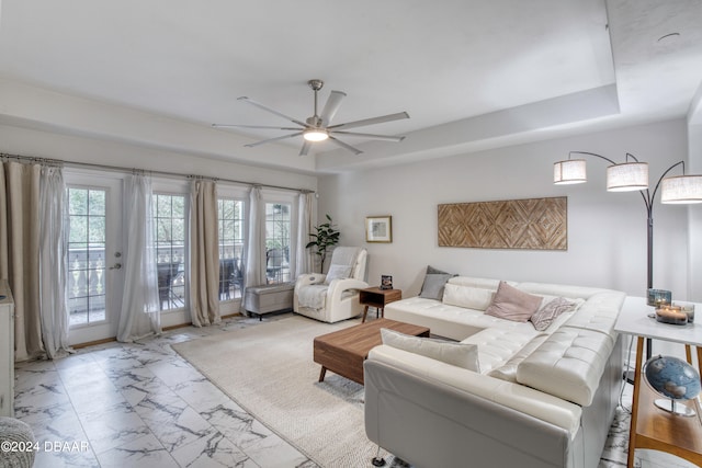 living room featuring french doors and ceiling fan