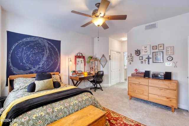 carpeted bedroom with ceiling fan and a closet