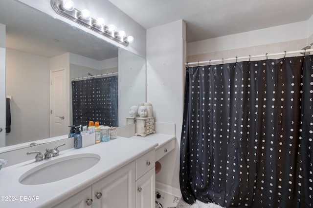 bathroom featuring vanity and walk in shower