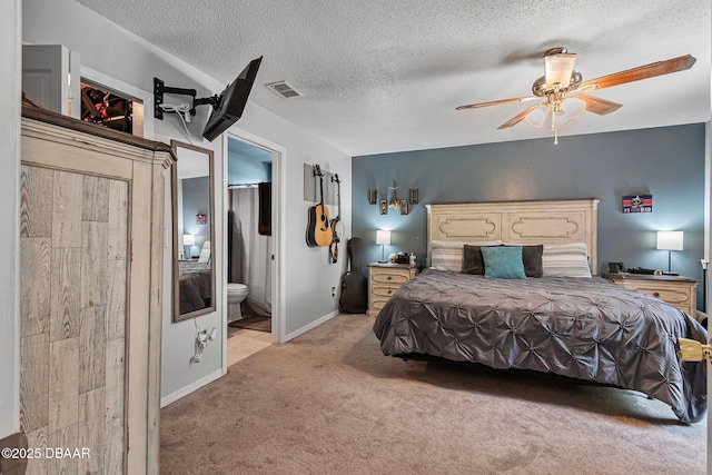 2509 Kumquat Dr, Edgewater, FL 32141 - carpeted bedroom featuring a textured ceiling, connected bathroom, a ceiling fan, and baseboards