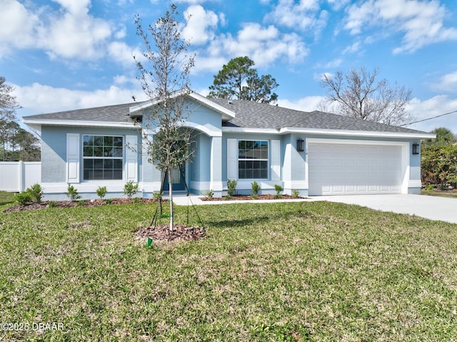 ranch-style home featuring a garage and a front yard