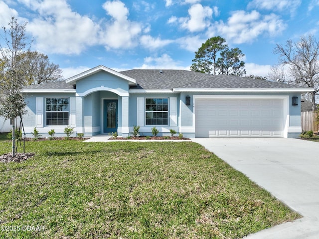 single story home featuring a garage and a front yard