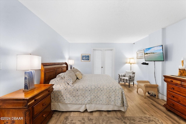 bedroom with light hardwood / wood-style flooring