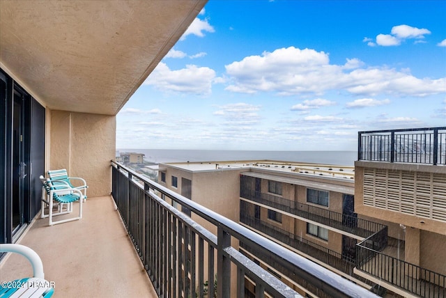 balcony featuring a water view