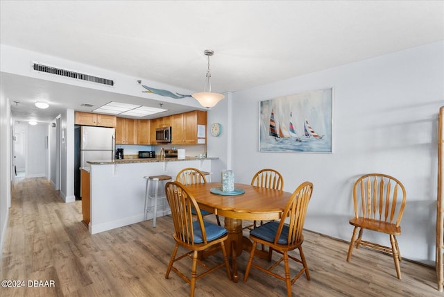 dining room featuring light hardwood / wood-style floors