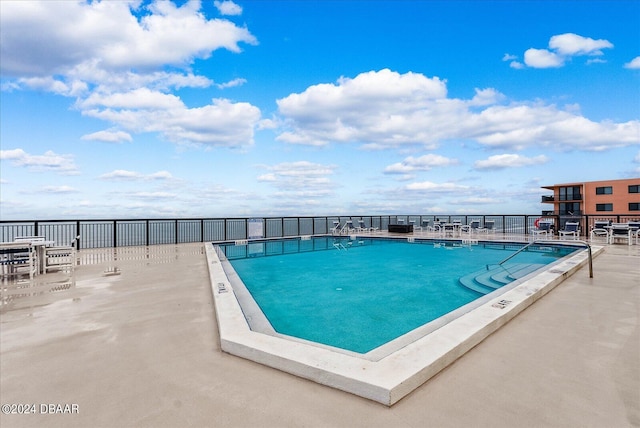 view of swimming pool with a patio area