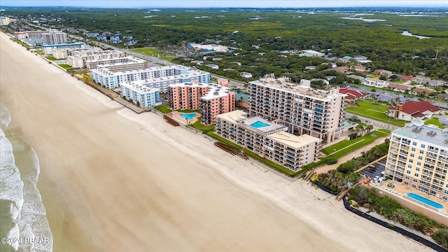 birds eye view of property featuring a water view and a view of the beach