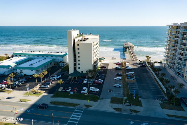 aerial view with a water view and a view of the beach