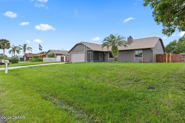 single story home with a garage and a front yard