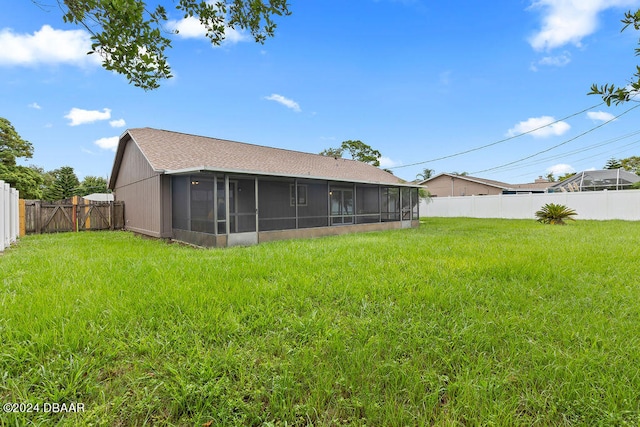 view of yard with a sunroom