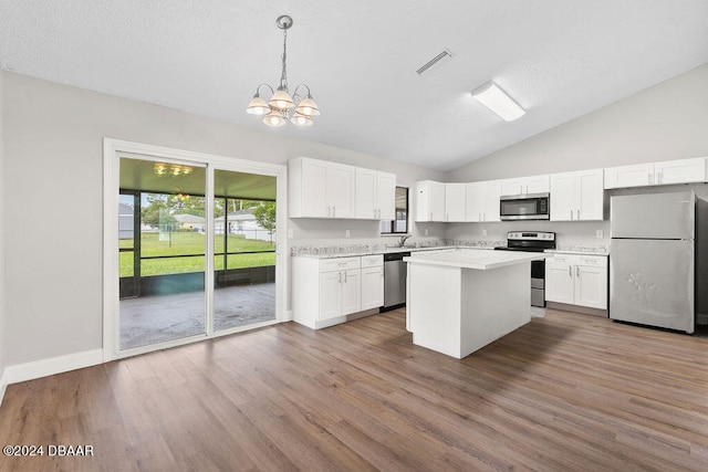 kitchen featuring dark wood-type flooring, white cabinets, and stainless steel appliances