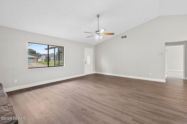 unfurnished living room featuring high vaulted ceiling, ceiling fan, a textured ceiling, and dark hardwood / wood-style floors