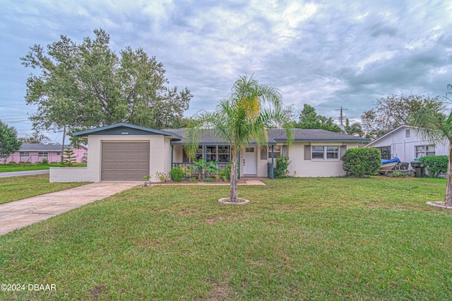 single story home featuring a front lawn and a garage