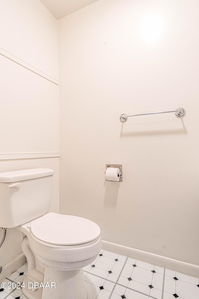 bathroom featuring tile patterned floors and toilet