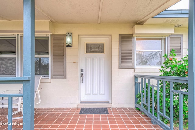 entrance to property featuring a porch