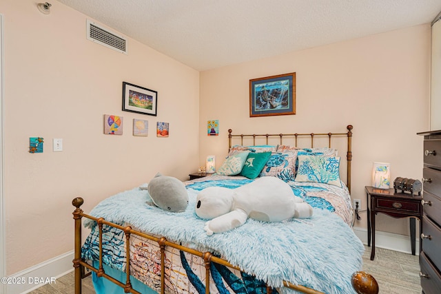 bedroom with a textured ceiling