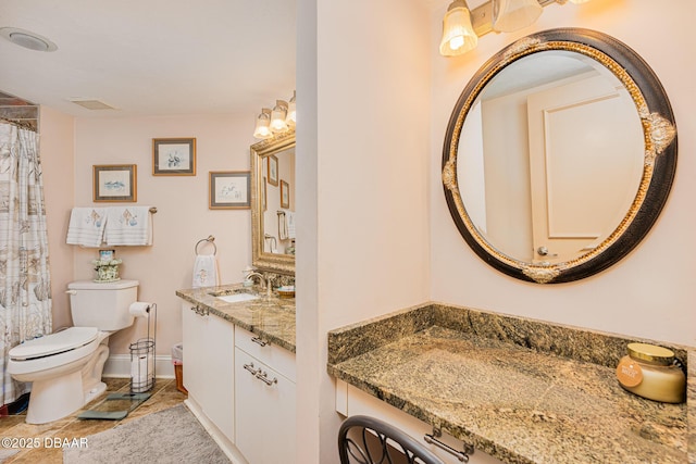 bathroom with vanity and toilet