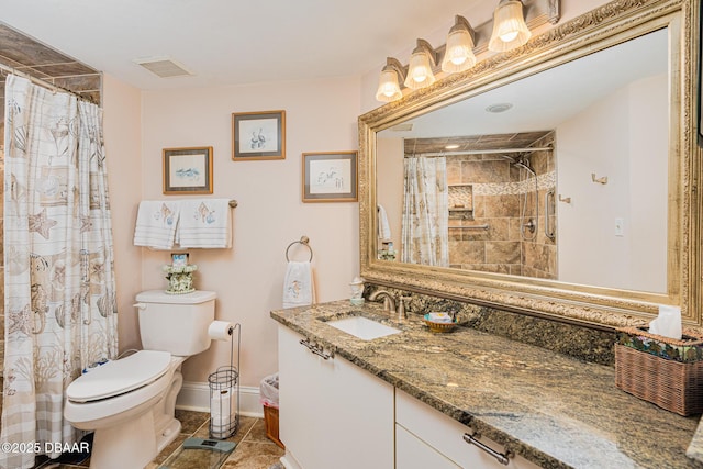 bathroom with a shower with shower curtain, tile patterned floors, vanity, and toilet