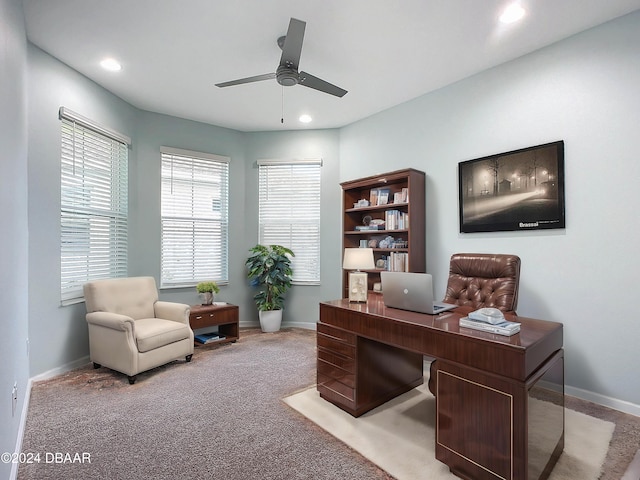 carpeted home office with ceiling fan