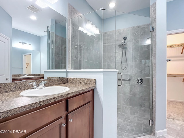 bathroom with vanity and walk in shower