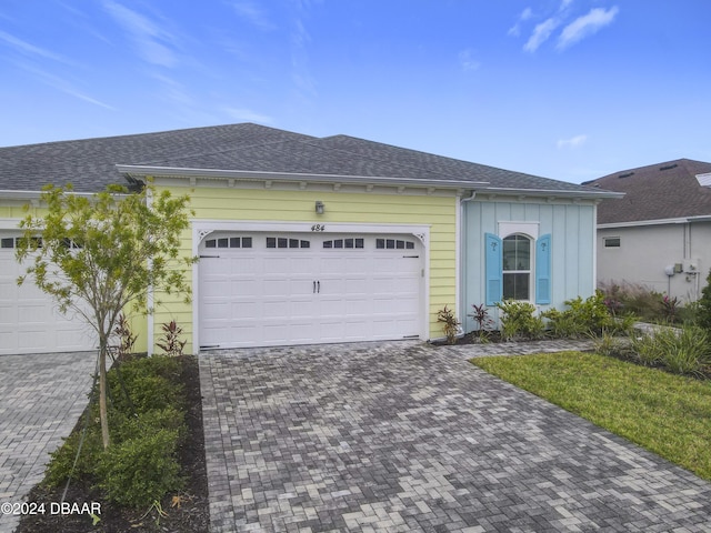 single story home featuring a garage