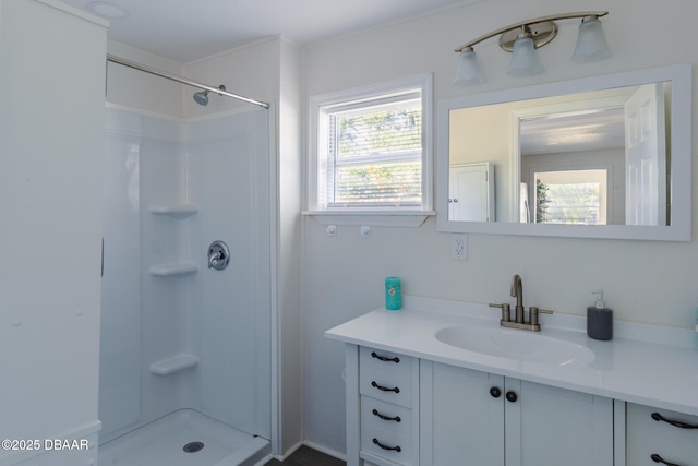 bathroom featuring vanity and a shower