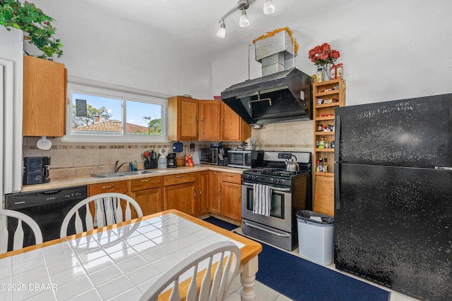 kitchen featuring black appliances, exhaust hood, tasteful backsplash, and a sink