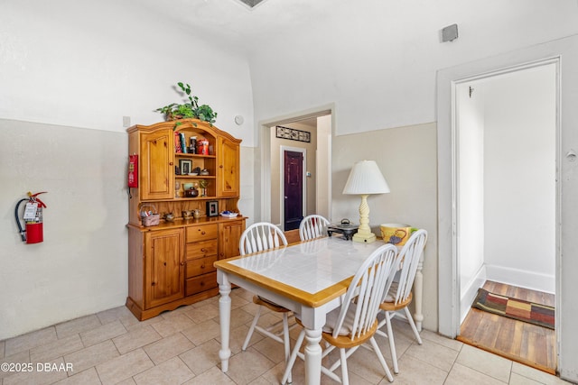 dining area featuring light tile patterned floors