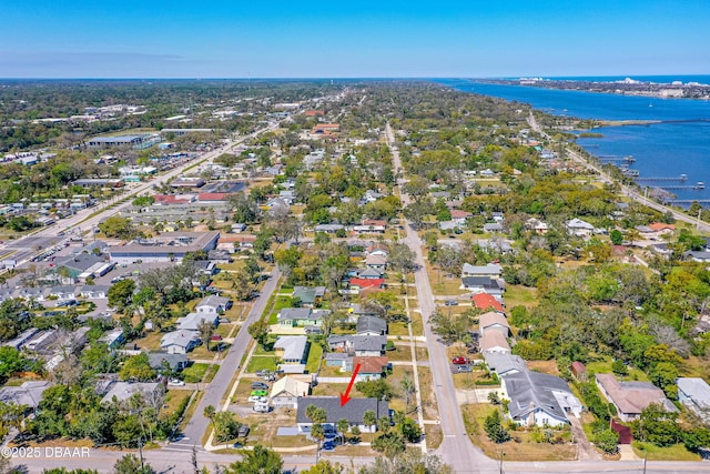 birds eye view of property featuring a residential view and a water view