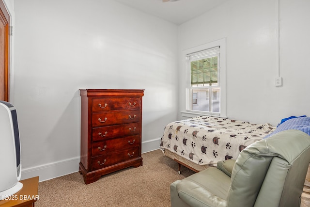 carpeted bedroom with baseboards