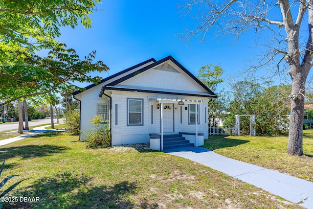 bungalow with a front yard