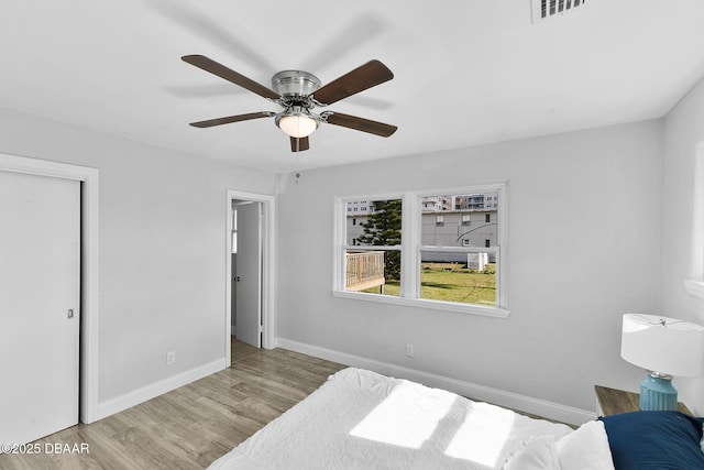 bedroom featuring ceiling fan and light wood-type flooring