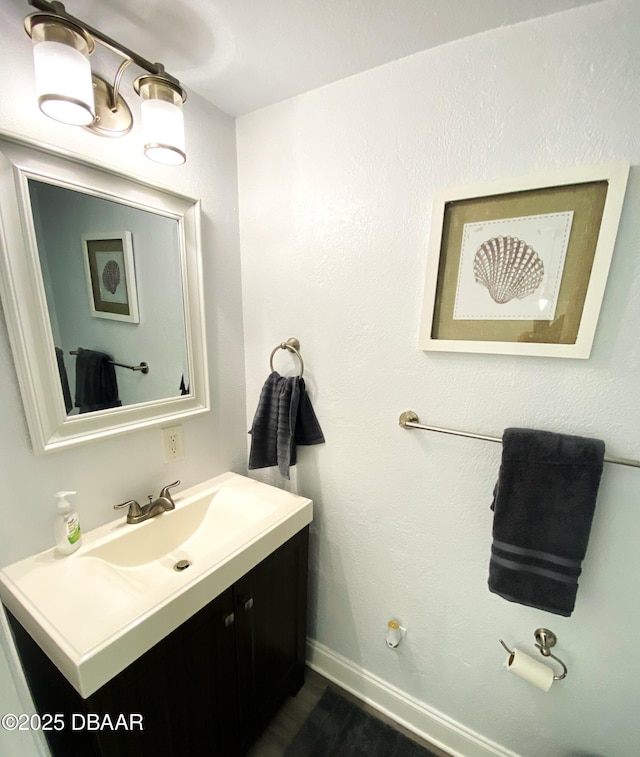 bathroom with vanity and wood-type flooring