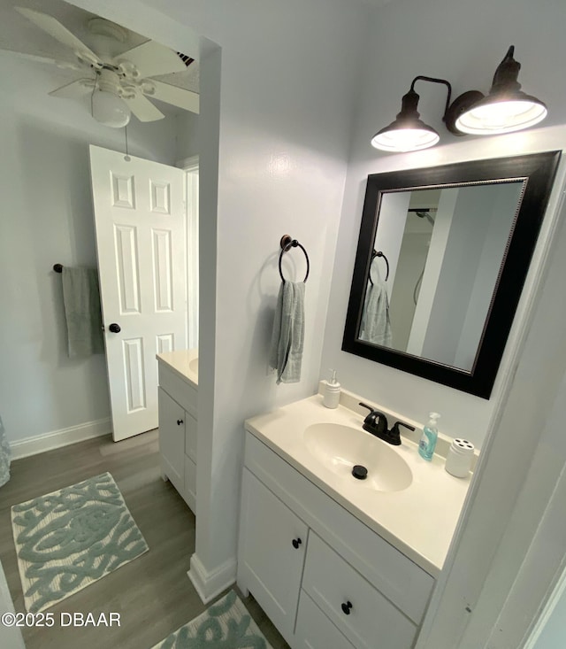 bathroom featuring vanity, wood-type flooring, and ceiling fan