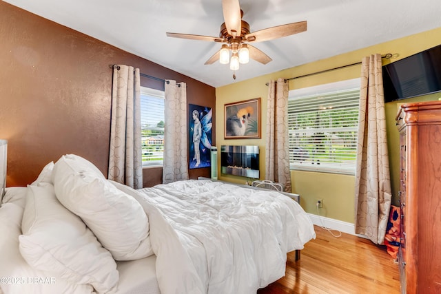 532 Lafayette St, Port Orange, FL 32127 - bedroom with wood finished floors, baseboards, and a ceiling fan
