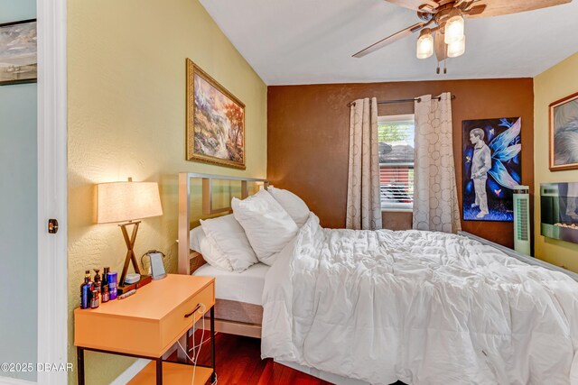 532 Lafayette St, Port Orange, FL 32127 - bedroom featuring wood finished floors, a ceiling fan, and a textured wall