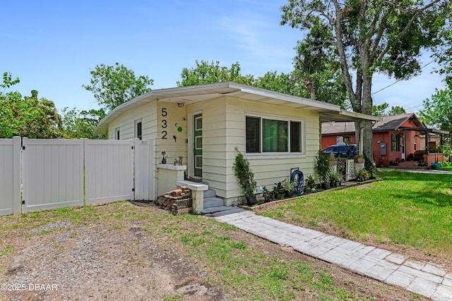 532 Lafayette St, Port Orange, FL 32127 - view of front of house with a gate