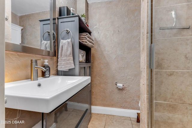 532 Lafayette St, Port Orange, FL 32127 - full bathroom with tile patterned flooring, baseboards, a sink, and a textured wall