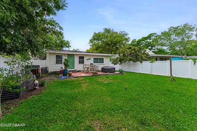 532 Lafayette St, Port Orange, FL 32127 - back of property featuring a vegetable garden and a patio