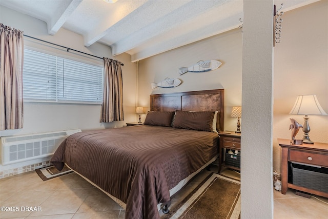 bedroom with radiator, a textured ceiling, beamed ceiling, and light tile patterned flooring