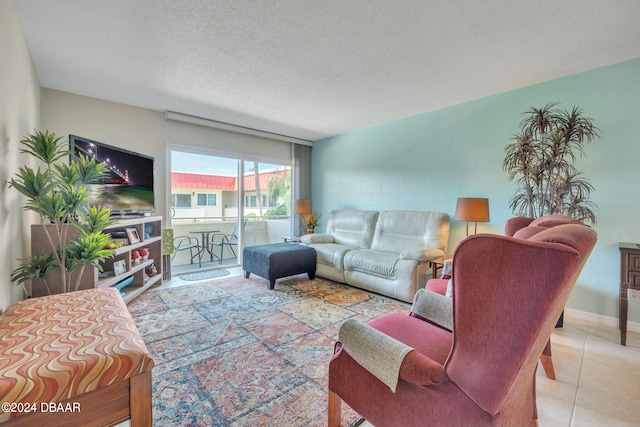 tiled living room featuring a textured ceiling