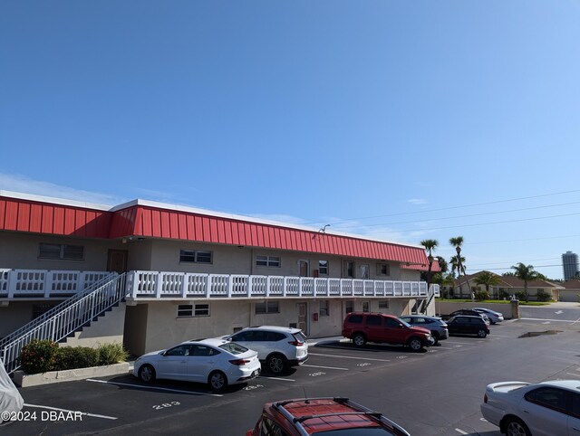 2901 N Halifax Ave Unit 218, Daytona Beach, FL 32118 - view of building exterior with uncovered parking