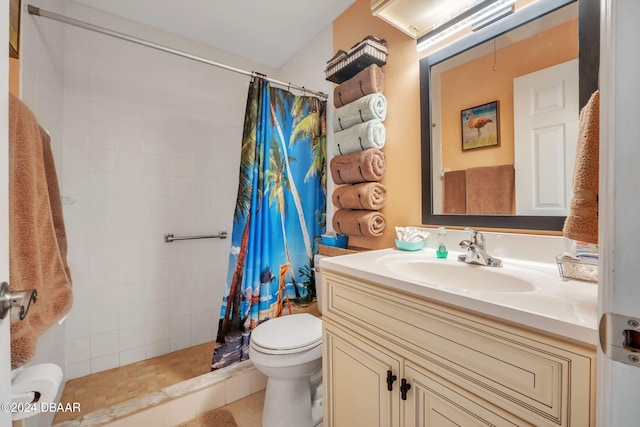 bathroom with walk in shower, vanity, and toilet