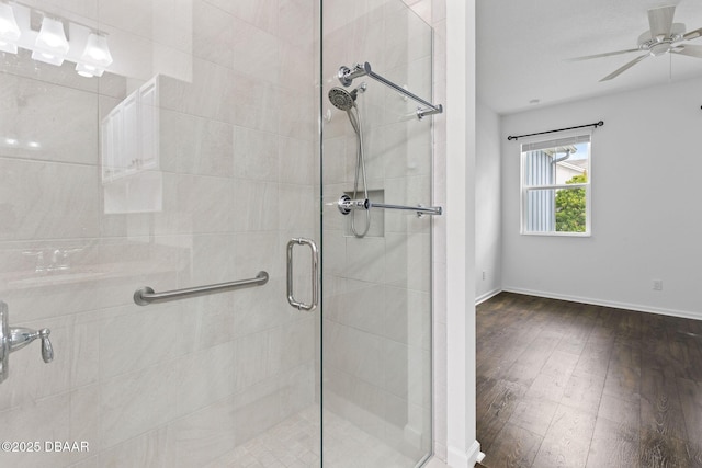 562 Landshark Blvd, Daytona Beach, FL 32124 - full bath featuring a shower stall, hardwood / wood-style floors, and a ceiling fan