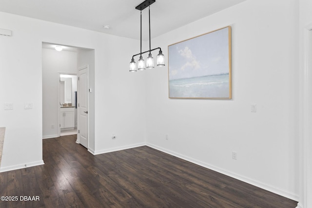 562 Landshark Blvd, Daytona Beach, FL 32124 - unfurnished dining area featuring dark wood-style floors and baseboards