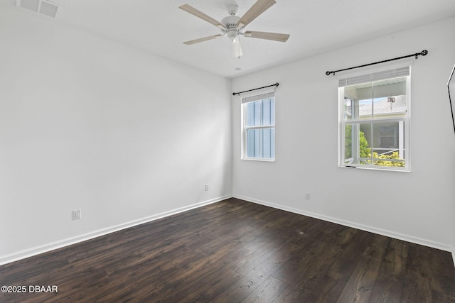 562 Landshark Blvd, Daytona Beach, FL 32124 - spare room featuring dark wood-style floors and ceiling fan