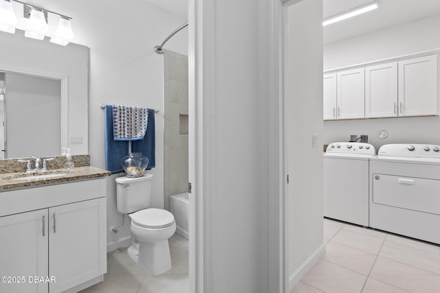 562 Landshark Blvd, Daytona Beach, FL 32124 - bathroom featuring washer and dryer, vanity, tile patterned floors, and shower / bath combination