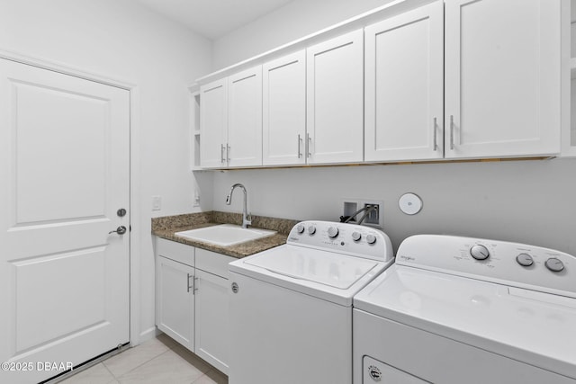 562 Landshark Blvd, Daytona Beach, FL 32124 - washroom with washing machine and dryer, cabinet space, and light tile patterned flooring